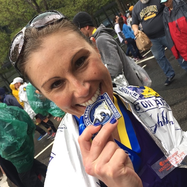 This is her...biting her Boston medal
